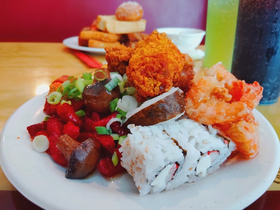Menu layout featuring raw and cooked sushi selections.